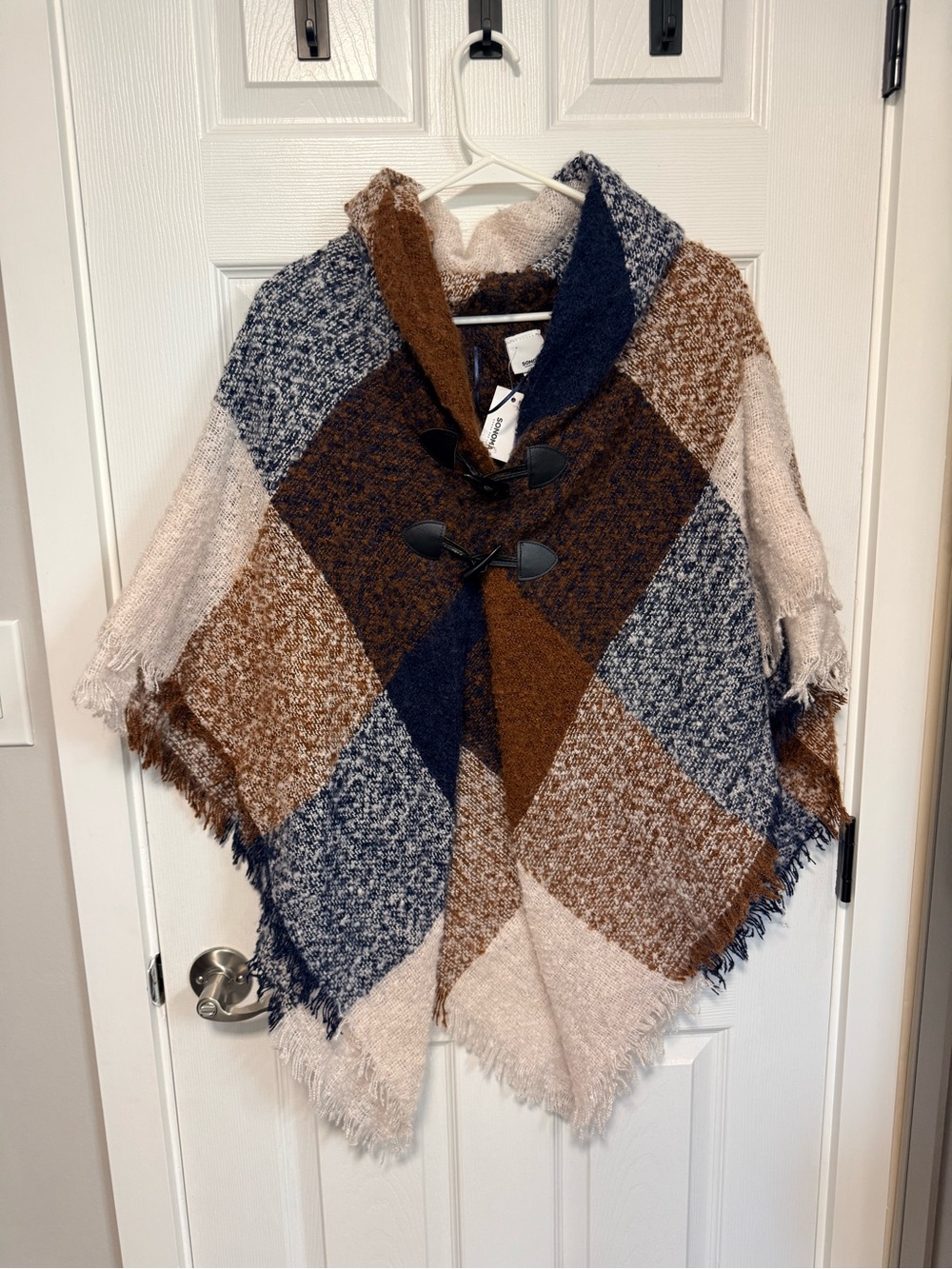 Soft and cozy poncho with button closures